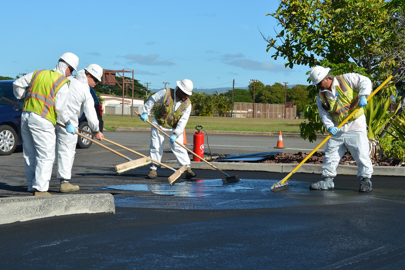 Parking Lot Sealcoating Crew Working Sol Simon Asphalt | Solomon & Simon Asphalt Paving